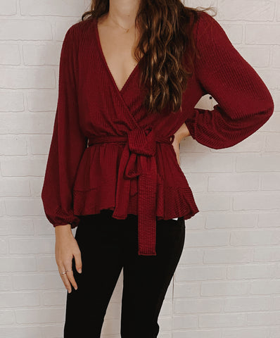 Burgundy Ruffle Hem Wrap Style Knit Blouse